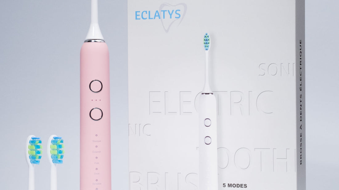 Manche rose SmartClean Pro Eclatys et son emballage, avec les boutons de réglage visibles.